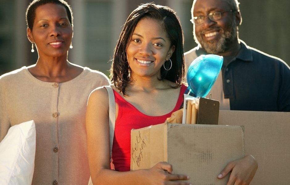 college moving day- a girl and her parents moving boxes